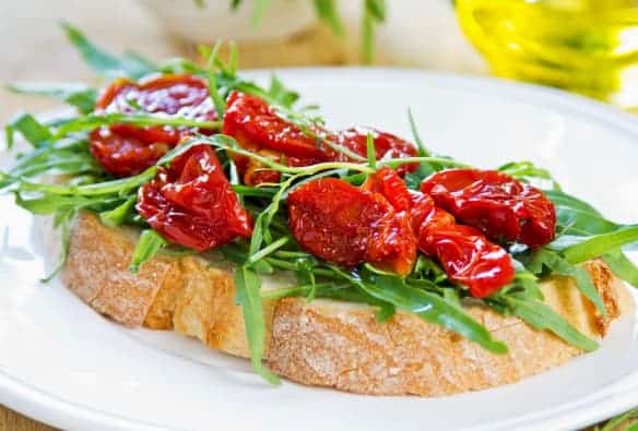 Sun-dried Tomatoes on Sourdough Slice of Bread with a Salad — Wholesale Food in Coffs Harbour, NSW